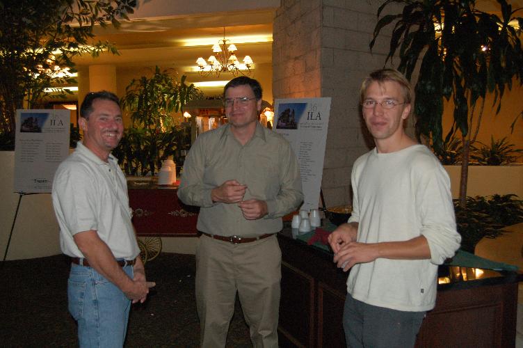 Chuck Schue, Ray Agostini, Wouter Pelgrum guarding the ILA signs